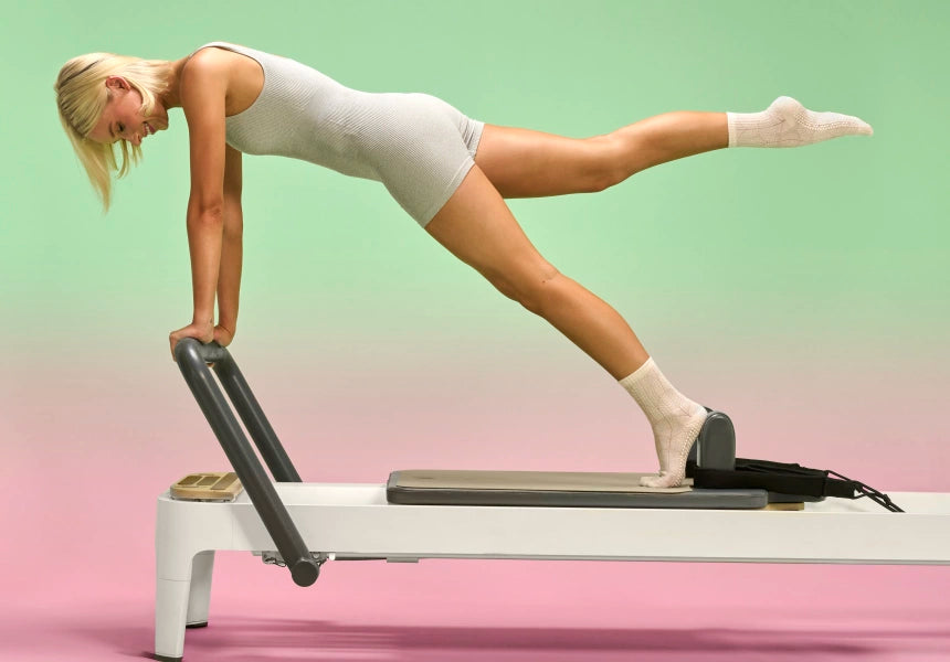 NXTWAVE grip socks in use during a Pilates class