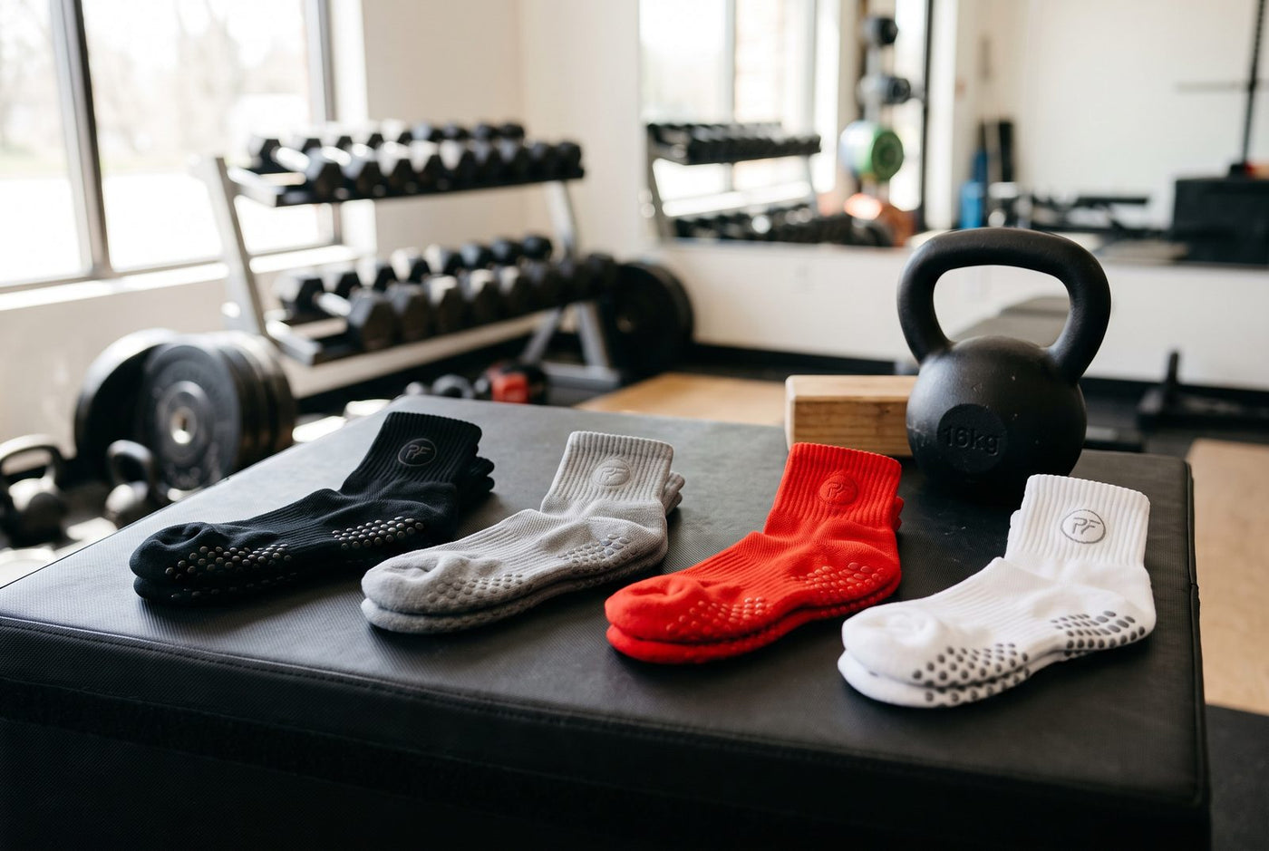 Custom NXTWAVE grip socks in a gym